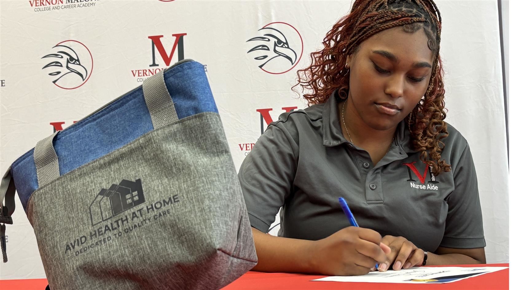 Vernon Malone student signs job contract
